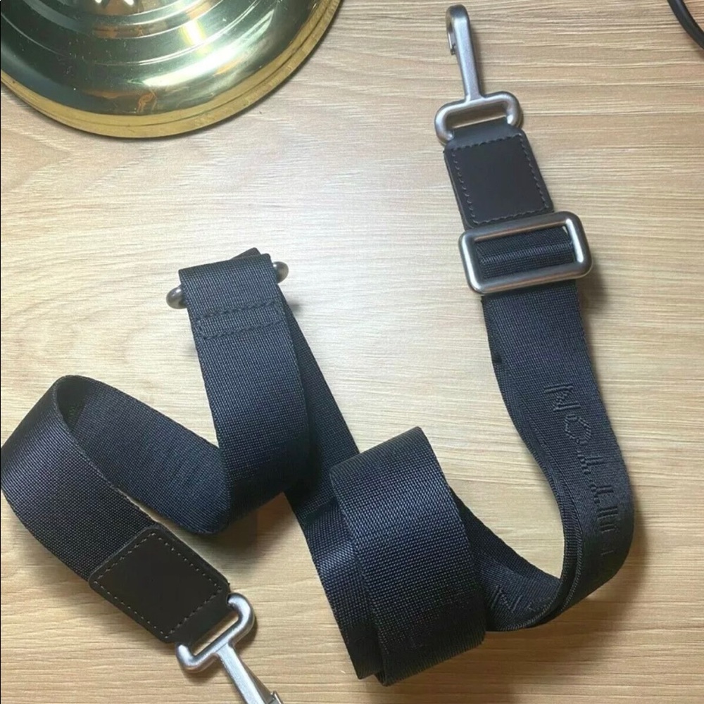 Louis Vuitton shoulder strap.